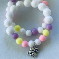 Stretch Bracelet Set For That Little Girl. 6 Inch Stretch Will Fit 5-9 Year Olds. Adorable Silver Tone Rabbit Charm Adorns White , Pink, Purple And Yellow Beads. Handmade In My Studio- Nwot Playful White Round Bead Bracelets, Playful White Round Beaded Bracelets, Cute White Beaded Round Bracelets, Cute White Round Bracelets, Playful White Stretch Bracelet As Gift, Playful White Bracelets For Gifts, Cute Handmade White Stretch Bracelet, White Stretch Bracelet As Gift, Playful White Hypoallergenic Jewelry