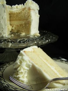 a slice of cake on a plate with a fork next to it and another piece missing