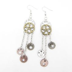 CosplayThese fabulous Jewelry Vintage Gears Earrings Steampunk will dazzle and add style to your ensemble. They are full of personality and make the perfect statement piece for any occasion. Whether you purchase them for yourself, as a gift, or for your special someone, these exquisite earrings will be sure to please. The steampunk design is stylish, industrial and vintage and will make a unique addition to your look. A perfect mix of Goth and Victorian, these trendy earrings will make a great g Handmade Alloy Earrings For Party, Metal Drop Earrings For Party, Nickel-free Alloy Earrings For Party, Metal Drop Cartilage Earrings For Party, Unique Metal Drop Cartilage Earrings, Gold Punk Dangle Jewelry, Gold Dangle Punk Jewelry, Trendy Metal Jewelry For Cosplay, Silver Metal Jewelry For Cosplay