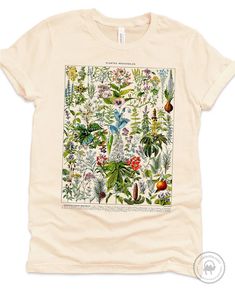 * A shirt inspired by the beautiful hand-drawn medicinal plants and their names by Adolphe Millot (1857-1921) included in 1909 Le Larousse pour tous : nouveau dictionnaire encyclopédique * Printed with Direct to Garment textile printer, creating soft to touch (i.e no layer on top of the shirt) full-color print that does not fade. Not an iron-on or heat transfer! * Printed on super soft, comfortable combed cotton shirts - you will love wearing it! * Both crew neck and v-necks are in Unisex/Men's Jane Austen Shirts, Outdoorsy Shirt, Adolphe Millot, Wildflower Shirt, Nature Enthusiast, Botanical Shirt, Custom Aprons, Personalized Aprons, Gardening Shirts