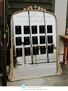 an ornate mirror with seating cards on it