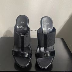 Elevate Your Shoe Collection With These Stylish Italian Shoemakers Women's Sandals In Black. Perfect For Any Occasion, From Travel To Workwear, These Slip-On Sandals Feature A High Wedge Heel Measuring Between 3-3.9 Inches, Providing A Comfortable And Trendy Look. The Sandals Are Designed With A Slip-On Closure For Ease Of Wear And Are Available In Us Shoe Size 5.5 Stretch Fabric New No Tags No Box Never Used Black Slip-on Wedge Sandals, Black Wedge Heel Sandals Medium Width, Black Medium Width Wedge Heel Sandals, Black Wedge Sandals With Removable Insole, Black Wedge Heel Sandals With Removable Insole, Black Wedge Sandals With Heel Loop, Black Synthetic Medium Width Wedge Sandals, Black Wedge Sandals With 4-inch Heel For Summer, Black Sandals With 4-inch Wedge Heel