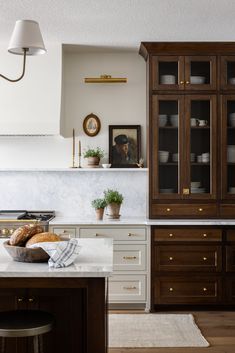 the kitchen is clean and ready to be used for cooking or baking, while also being used as a dining area