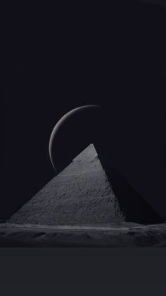 an image of the moon and its shadow in the dark night sky over a pyramid