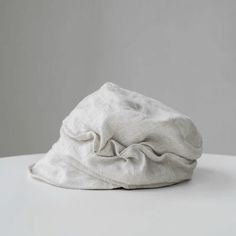 a white hat sitting on top of a table