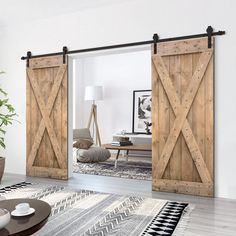 Calhome sliding rail hardware and barn door kits contain everything needed to transform any doorway into an elegantly beautiful passageway between spaces. The front-mounted hardware and exposed rollers give it a timeless look that complements any contemporary, rustic, or industrial decor. All hardware is constructed of high-quality powder-coated steel. Each piece of wood has natural knot patterns which make every door unique. The design provides a stunning focal point for any space while also pr Knotty Pine Paneling, Wood Barn Door, Diy Barn, Barn Door Kit, Wood Barn, Metal Barn, Double Barn Doors, Door Hardware Interior, Diy Barn Door