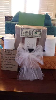 the gift basket is filled with toilet paper and other items