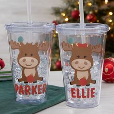 two personalized tumblers with reindeer faces on them