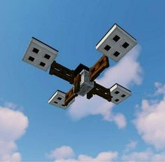 an abstract image of cubes floating in the air against a blue sky with white clouds