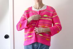 "This is one of the funkiest cardis I've ever come across- It gives off some Coogi vibes with the pattern, except that it's super bright, neon highlighter-esque colors. Welted knit with psychadelic accents. Square neckline, and no closure. Just a bright, cheerful snuggle sweater! Size: No size tag, see measurements below Fabric: No fabric tag, feels like acryllic Brand: Fobya Measurements*: Length:21\" Bust: 21\" Waist: 21\" Hip: 21\" Sleeve: 21\" *All measurements are taken flat- please double where appropriate and compare with a garment you own to determine fit. Excellent used condition. Item is pre-loved, but no noteworthy problems! Unless otherwise noted each item has been cleaned in accordance with instructions on tag and has been stored in a smoke free/pet free environment. May have Neon Sweater, Olive Green Sweater, Pink Neon, Fair Isle Sweater, Fabric Projects, Neon Color, Fabric Tags, Knitting Inspiration, Jumpers And Cardigans