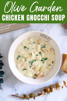 a white bowl filled with chicken gnocchi soup on top of a marble counter