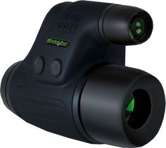 a black and green night vision device on a white background with the lens facing upwards