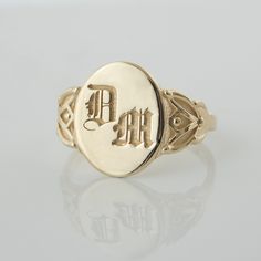 This vintage-style signet ring is inspired by our classic botanical style, and features leaf-like flourishes on each size, framing a simple center that displays your personal monogram or initials. CUSTOMIZATION AND FONTS * Usually Gothic letters are preferred for this ring, but I can place any type of design or font. * This ring can be customized with any letter or word (provided it fits) and is made in solid gold. This ring can be made for men or women and in your preferred size or color of gol Classic Engraved Signet Ring, Classic Oval Signet Ring With Initials, Classic Oval Signet Ring Personalized, Classic Personalized Oval Signet Ring, Classic Formal Signet Ring With Initials, Timeless Oval Initial Ring, Classic Oval Ring With Initials, Classic Initial Ring With Engraving Option, Classic Signet Ring With Initials