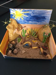 a desert scene made out of sand and rocks