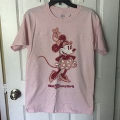 Purchased At Disney. Never Worn. Disney Minnie Mouse Pink T-shirt, Minnie Mouse Short Sleeve T-shirt For Disney Trips, Minnie Mouse Crew Neck Top For Disney Trips, Disney Character Print Cotton T-shirt, Pink Disney Cotton T-shirt, Cute Pink Minnie Mouse T-shirt, Minnie Mouse Crew Neck Top For Disney Events, Pink Minnie Mouse T-shirt For Disney Fan Events, Disney Pink Minnie Mouse T-shirt