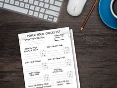 a checklist sitting on top of a wooden table next to a keyboard and mouse