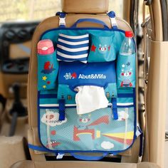 a child's car seat with various items in the back and side pockets on it