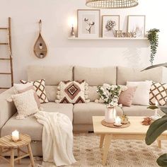 a living room filled with lots of furniture and decor on top of a white floor