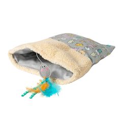 a stuffed animal is in a blanket with a toy on it's back end