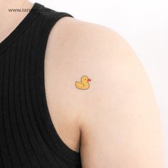 a woman with a rubber ducky tattoo on her arm