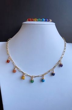 7 chakras necklace, handmade rainbow chain, seven chakras jewelry, gemstone drop charm necklace, seven chakras, spirituality,  Our seven chakras necklace is beautifully handmade with 14k gold filled chain and natural Gemstones.  Necklace Size: 16 inches  🔴 This listing is for the Chakra Necklace  Necklace, only.  🔴 If you would like the Set, here is the listing of the 7 chakras bracelet . https://www.etsy.com/listing/1197810863/7-chakras-gold-bracelet-double?click_key=5471acf3903477ce2d820d4ae91a317a872ea058%3A1197810863&click_sum=87553f6d&ref=shop_home_active_9&frs=1&cns=1 ⭐️ These items are made to order. Please allow 3-5 days for the item to be processed. ⭐️Returns and exchanges: Please contact me within 7 days if you are not happy with your purchase and I will try to fix any problem Chakra Necklace Diy, Chakra Necklace Tutorial, Multicolor Spiritual Beaded Chain Jewelry, Chakras Jewelry, Chakras Necklace, 7 Chakras Necklace, 7 Chakras Bracelet, Chakras Bracelet, Chakra Necklace Crystals