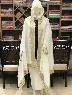 Complement your outfit with this Crepe Silk Summer Cape. This is very easy to style cape and it can be paired with any top, blouse, dress, or any other thing, no doubt you'll stand out from the crowd.Product Details- Condition Brand New - Style: Cape- Fabric: Crepe Silk - Fully lined from the back.- Embroidery: Zari Work - Colour: White- Size: 82" X 35" (208.28 cms X 88.9 cms) approx.- Care Instructions: Dry Clean Only.If you want a bigger or smaller size (dimensions), we can make it for you on Traditional Drape Abaya With Resham Embroidery, Traditional Cape-shaped Dupatta For Designer Wear, Traditional Cape Style Dupatta For Eid, Traditional Cape Kaftan For Wedding, Traditional Wedding Kaftan With Cape Shape, Traditional Wedding Cape Kaftan, Traditional Wedding Kaftan With Cape, Traditional Cape-style Dupatta For Festive Occasions, Traditional Festive Dupatta With Cape Shape