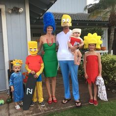 the family is dressed up in costumes for halloween