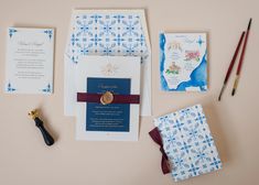 the wedding stationery is laid out on the table