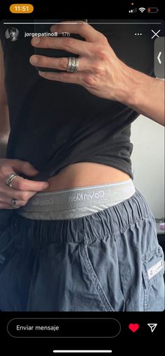 a woman's stomach is shown with her hand on the waist and wearing an engagement ring