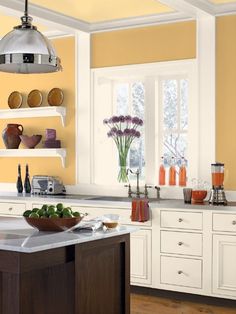 an orange and white kitchen is featured on the app store's iphone photo sharing page