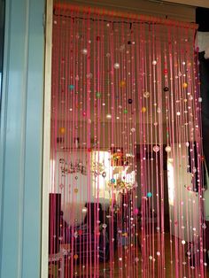 the door is decorated with beads and streamers