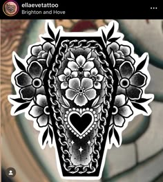 an intricately designed sticker with a heart in the center and flowers on it