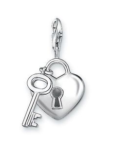 a heart shaped key is attached to a chain with a lock on it's side