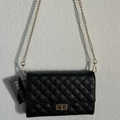 Parisian Small Crossbody Bag In Black Color Brand New With Tags! Gold-Tone Hardware Quilted Faux Leather In Black Color Turn Lock Closure Can Be Converted To A Clutch Bag Interior: 3 Compartments With 1 Zippered Pocket 6 Credit Card Slots, 1 Slip Pocket Detachable Crossbody Strap With Chain, Measures Approximate 25"L Approximate Measurements: 7.25" L X 5” H X 1” D Brand New With Tags Imported Purses Black Women, Black Purse Gold Chain, Small Black Purse Outfit, Hoco Purses, Black Purse With Gold Chain, Black Purse Outfit, Black And Gold Purse, Black Mini Purse, Jeans For School