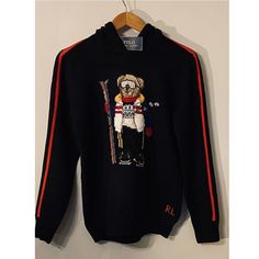 This Hooded Sweater Features Our Iconic Polo Bear Dressed For A Day On The Slopes. Shell: 100% Cotton. Design: 81% Wool, 19% Cotton. Machine Washable. Size Medium Has A 21.5" Body Length (Front And Back) And A 20.5" Sleeve Length. Hood. Long Sleeves With Rib-Knit Cuffs. Polo Bear Intarsia-Knit At The Center Front. "Rl" Cross-Stitched At The Left Hem. Rib-Knit Hem. Imported. Style Number: 629069 Color: Black Size: Boys Large 14-16 (160cm) Condition: New With Tag, New In Plastic Ships From Smoke F Ralph Lauren Long Sleeve Winter Sweater, Ralph Lauren Long Sleeve Winter Tops, Black Ralph Lauren Winter Outerwear, Ralph Lauren Black Outerwear For Winter, Ralph Lauren Black Winter Outerwear, Ralph Lauren Sporty Hooded Sweatshirt, Navy Winter Sweater For Streetwear, Ralph Lauren Sweatshirt For Winter Streetwear, Ralph Lauren Winter Hoodie For Streetwear