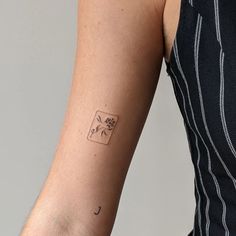 a person with a small tattoo on their arm