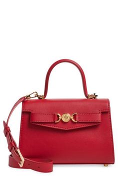 A signature Medusa-head medallion—based on the molded door of Versace's first headquarters—adds shine against the smooth leather of this structured bag. Magnetic-snap flap closure Top carry handle; removable, adjustable crossbody strap Interior wall pocket Protective metal feet Leather lining Leather Made in Italy Designer Handbags Luxury Formal Bags With Logo Plaque, Luxury Formal Bag With Logo Plaque, Luxury Shoulder Bag With Logo Plaque And Top Handle, Elegant Top Handle Shoulder Bag With Logo Plaque, Elegant Rectangular Bag With Logo Plaque, Luxury Shoulder Bag With Top Handle And Logo Plaque, Elegant Crossbody Bag With Logo Plaque, Formal Top Handle Shoulder Bag With Logo Plaque, Elegant Formal Bag With Logo Plaque