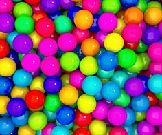 many different colored balls are scattered together