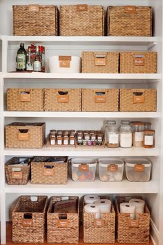 White pantry shelves with wicker baskets organizing all our pantry food, each basket has a small wooden label on it so we know what is inside! We have little shelves that hold our glass jar spices and containers full of sugar, flour, pasta, and more. Open Shelf Pantry, Pantry Shelf Organizer, Spring Organization, Open Pantry, Pantry Baskets, Small Pantry Organization, Basket Labels, Pantry Organisation, Organized Pantry