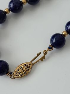 "Cheer up with this genuine blue lapis with gold tone spacer beads. Lapis stones have gold lines and are approx. 8mm. round Clasp: filigree fishhook Length approx. 25\" Condition: Good vintage" Lapis Necklace, Blue Lapis, Gold Line, Silver Pieces, Cheer Up, Vintage Fabrics, Fish Hook, Antique Items, Spacer Beads