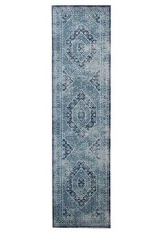 a blue runner rug with an ornate design