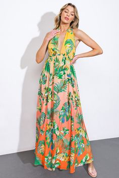 Indulge in the timeless elegance of our woven maxi dress, printed with a charming halter neckline and a full, flowing skirt. The plunging back and delicate neck tie add a touch of sophistication to this exquisite piece. Details:Self : 100% PolyesterLining : 100% PolyesterSize & Fit- Model is 5`8" And Wearing Size Small- Measurements Taken From Size Small- Approx. Length: 60" Tropical Print Maxi Dress For Garden Party, Green Printed Halter Neck Maxi Dress, Orange Sleeveless Tie-back Maxi Dress, Orange Sleeveless Maxi Dress With Tie Back, Sleeveless Orange Maxi Dress With Tie Back, Flowy Tropical Maxi Dress For Garden Party, Summer Halter Neck Maxi Dress With Smocked Back, Orange Backless Maxi Dress For Beach, Orange Backless Summer Maxi Dress