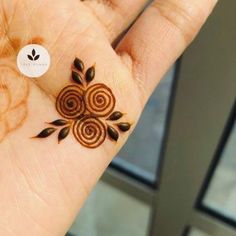 a person's hand with a hendi design on the middle of their palm