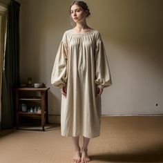 【Fabric】 Made from high-quality linen, this dress is light, breathable, and comfortable for warm weather wear. 【Style】 A relaxed yet stylish design. The minimalist style makes it versatile for any occasion, from casual to semi-formal.  【Features】 Featuring a clean, simple cut with a comfortable fit. The linen fabric provides a relaxed, breathable feel, making it perfect for day-to-day wear. 【Occasion】 Ideal for casual outings, renaissance fairs, Cosplay festival or even as a chic daytime dress. Folk Style Long Sleeve Dresses For Daywear, Long Sleeve Folk Dresses For Daywear, Peasant Dress With Gathered Bishop Sleeves, Peasant Style Medieval Dress With Long Sleeves, Cotton Peasant Dress For Daywear, Long Sleeve Cotton Peasant Dress, Long Sleeve Peasant Prairie Dress For Daywear, Vintage Peasant Dress, Designer Pictures