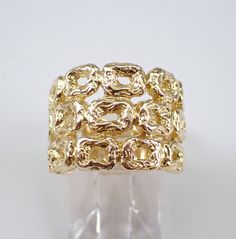 Solid 14K Yellow Gold Vintage Multi Row Anniversary Ring. This ring weighs 8.4 grams, measures 15 mm in width at its widest point and is a finger size 5 1/4, can be resized (please inquire about sizing with the finger size you need). This ring dates back to Circa 1980's.  I will ship this ring promptly in a beautiful gift box.    ADDITIONAL REQUESTS If you would like to see more pictures of this item, please let us know and we would be happy to provide them for you. Please contact us with all qu Luxury Gold Open Band Signet Ring, Gold Open Band Signet Ring Fine Jewelry, Gold Open Band Signet Ring For Anniversary, Elegant Gold Nugget Ring, Hallmarked Yellow Gold Wide Band Jewelry, Unique Yellow Gold Open Band Jewelry, Gold Hallmarked Wide Band Ring Fine Jewelry, Luxury Gold Wide Band Ring Hallmarked, Gold Wide Band Ring Fine Jewelry