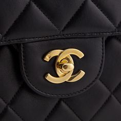 A rewrite on the classic 'Chanel Double Flap Bag', this Chanel offers its dual flaps within twin sets of single flaps. Each side of this black quilted lambskin bag offers a single flap, secured via gold-plated CC turnlock closure. The fixed shoulder strap offers the timeless Chanel look, with a woven leather & chain-link doubled over design. Inside this Chanel bag, an unquilted black leather interior offers a flat slip pocket on one side, and a flat zip pocket on the other. Timeless, with an unexpected design, this Chanel Black Quilted Lambskin Vintage Jumbo Double Sided Classic Flap Bag is the forever piece you've been searching for! Classic Quilted Flap Bag For Formal Occasions, Classic Black Quilted Flap Bag, Luxury Quilted Flap Bag, Timeless Quilted Double Flap Bag, Designer Top Handle Flap Bag With Cc Turnlock, Designer Top Handle Flap Bag With Cc Turnlock Closure, Classic Flap Bag With Cc Turnlock Closure, Quilted Double Flap Shoulder Bag For Business, Luxury Quilted Double Flap Bag