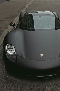 a black sports car parked on the street