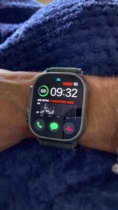 an apple watch on someone's arm showing the time and location of their activity