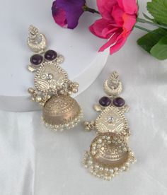 These 925 Silver Coated handcrafted big statement Jhumki earrings with pearls dangling can complement a wide range of styles, from bohemian and casual to formal and ethnic, making them suitable for various occasions. Earrings Length: Approx. 4.25" Weight of each earring: 27 gms Very lightweight to wear Brass as the base metal Availability: In-Stock *Color may vary slightly due to light condition & photography. Jewelry Care: Keep away from moisture. Allow perfumes and lotion to dry before wearing Elegant Silver Jhumkas For Festival, Handmade Elegant Earrings For Navratri, Elegant Handmade Earrings For Navratri, Elegant Heavy Jhumkas For Festival, Elegant Festival Jhumkas, Elegant Metal Jhumkas For Festival, Elegant Jhumkas For Festive Occasions, Diwali Pearl Drop Jhumkas, Elegant Dangle Jhumkas For Festivals