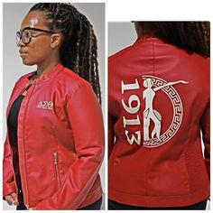 a woman wearing a red leather jacket with white lettering on the front and back side